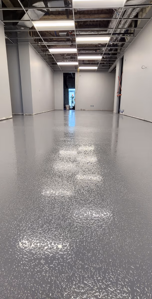 Finished concrete floor coating application
